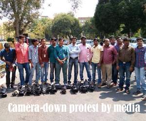 Camera-down protest by media