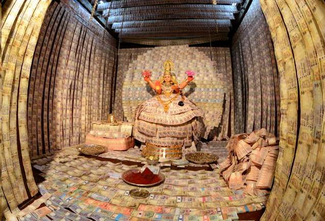 Hindu god decorated with currency