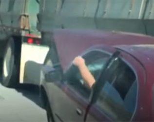 CAR, LODGED UNDER SEMITRUCK, DRAGGED ALONG CAJON PASS
