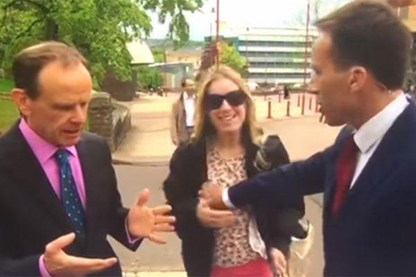 REPORTER GRABBED A WOMAN'S BOOB TO MOVE HER OFF-CAMERA