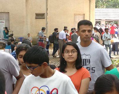 Rahul Dravid in a queue with his kids at a science exhibition.