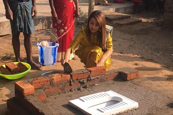 Trisha-Spotted-Raising-a-Toilet