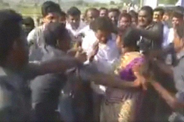 jagan-lady-fan-jumps-on-him-during-padayatra