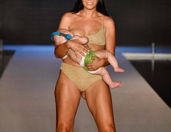 Fashion Runway Show While Breastfeeding Her Baby