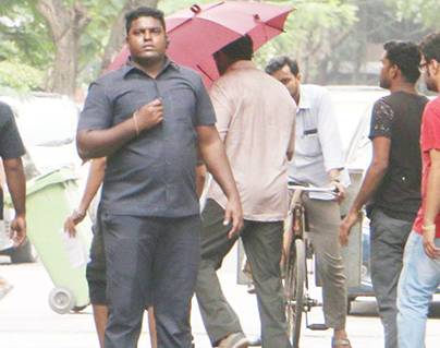 Star Hero Hiding His Face Under an Umbrella