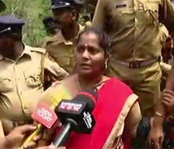 Woman devotee Madhavi with her children returning mid-day from her journey to SabarimalaTemple