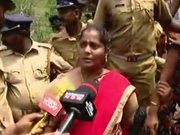 Woman devotee Madhavi with her children returning mid-day from her journey to SabarimalaTemple