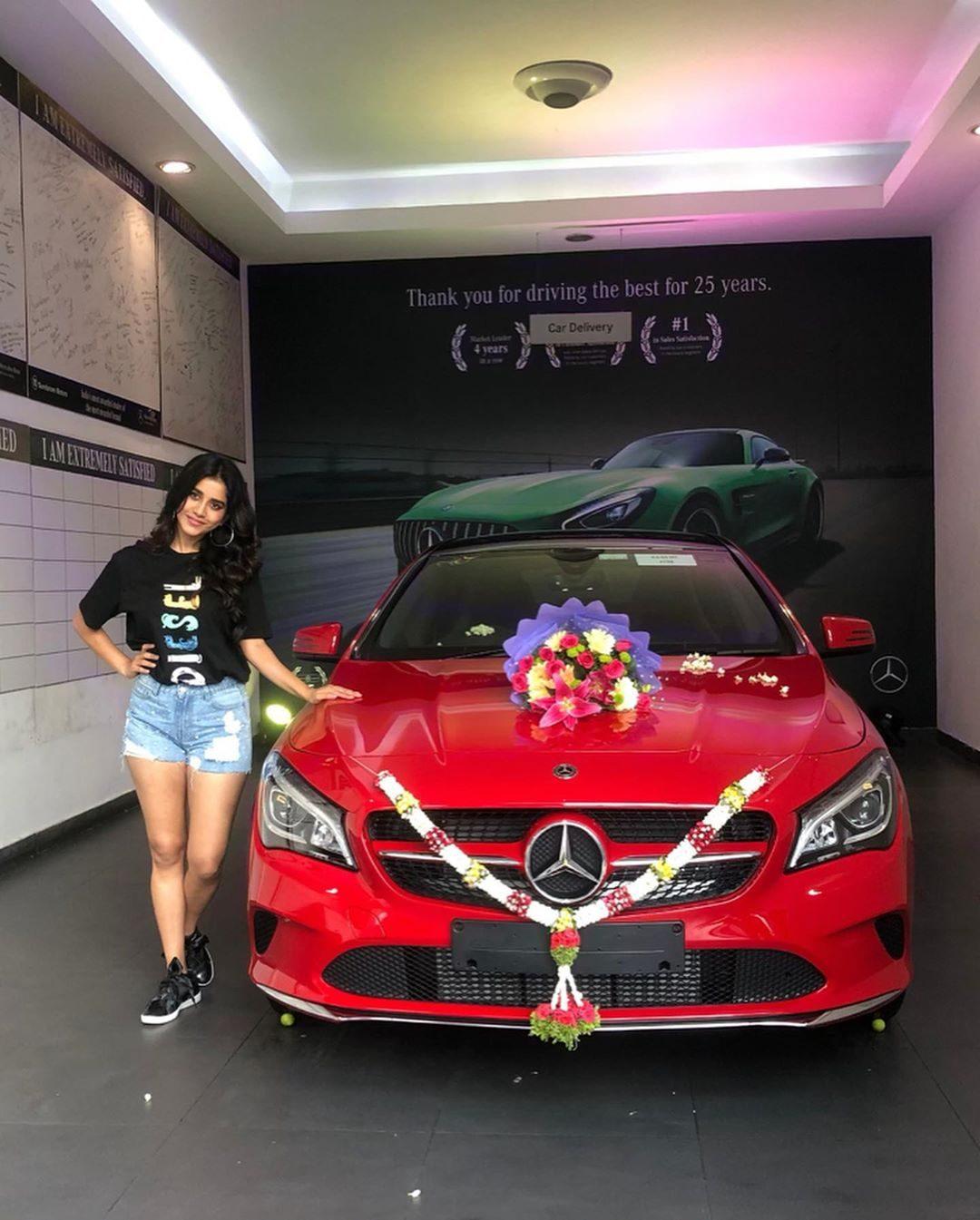 Nabha-Natesh-Mercedes-benz-red-car-