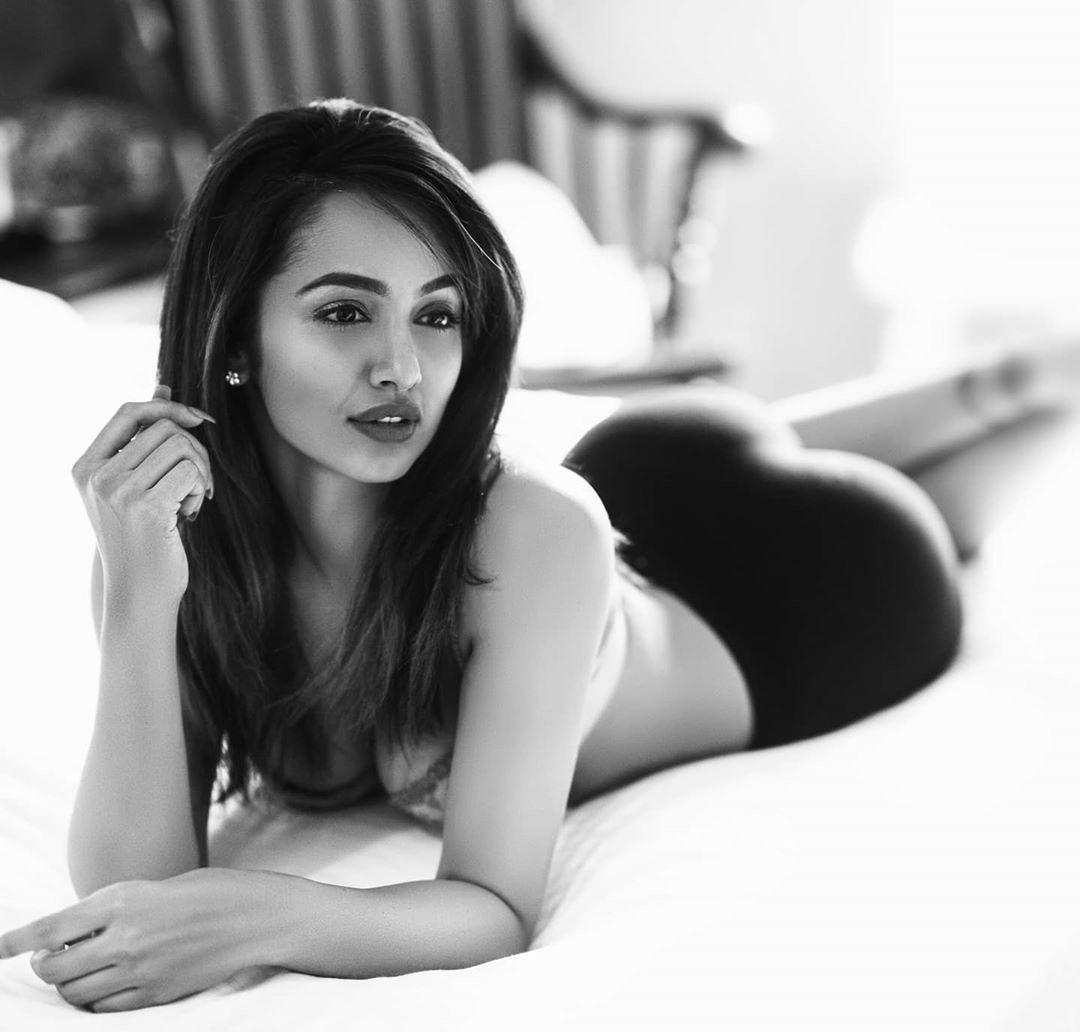 Lying on Bosom, Telugu Girl Tejaswi Madivada's Seducing Pose
