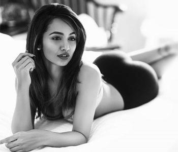 Lying on Bosom, Telugu Girl Tejaswi Madivada's Seducing Pose