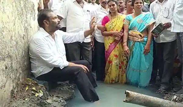 Viral Video: YCP MLA Sits In A Drain As A Protest