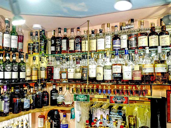 AP Govt Allows liqour shops upto midnight 1am