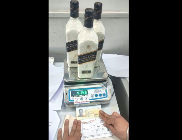 Cops Caught 3 Whisky Bottles