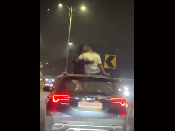 Couple Kissing on Car