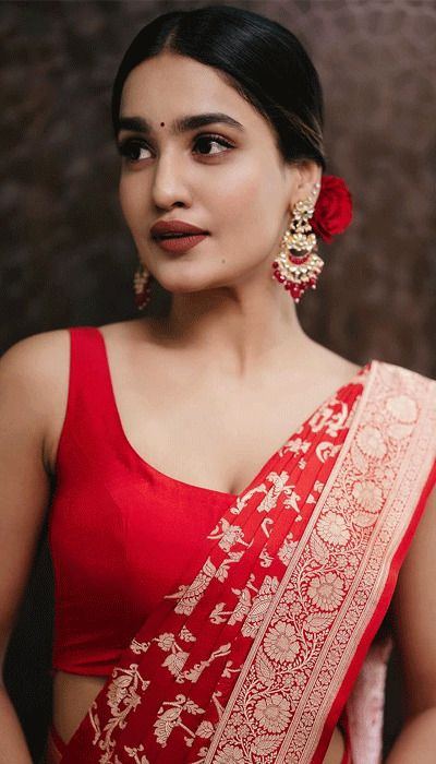 Saniya Iyappan Stills In Red Saree