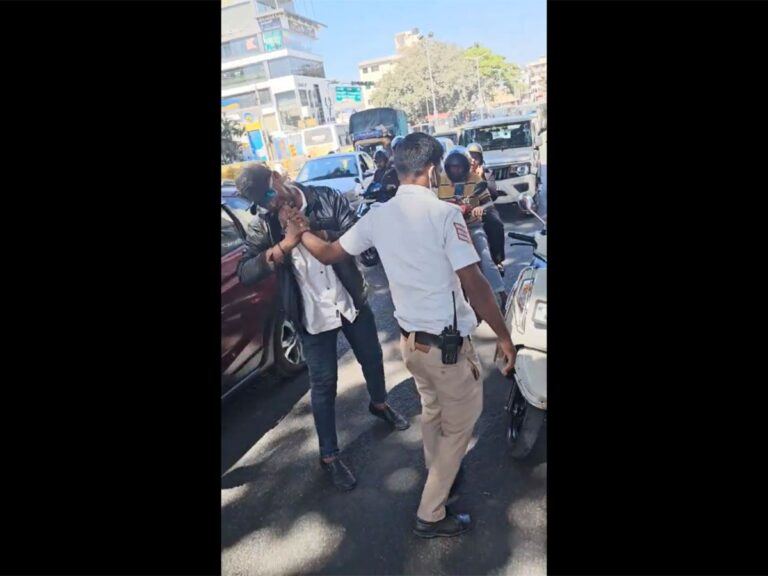 Traffic-Police-officer-and-a-Scooty-Rider-over-Not-Wearing-Helmet