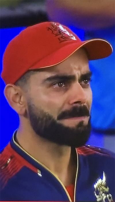 Pics: RCB Lifts IPL Trophy, Kohli In Tears