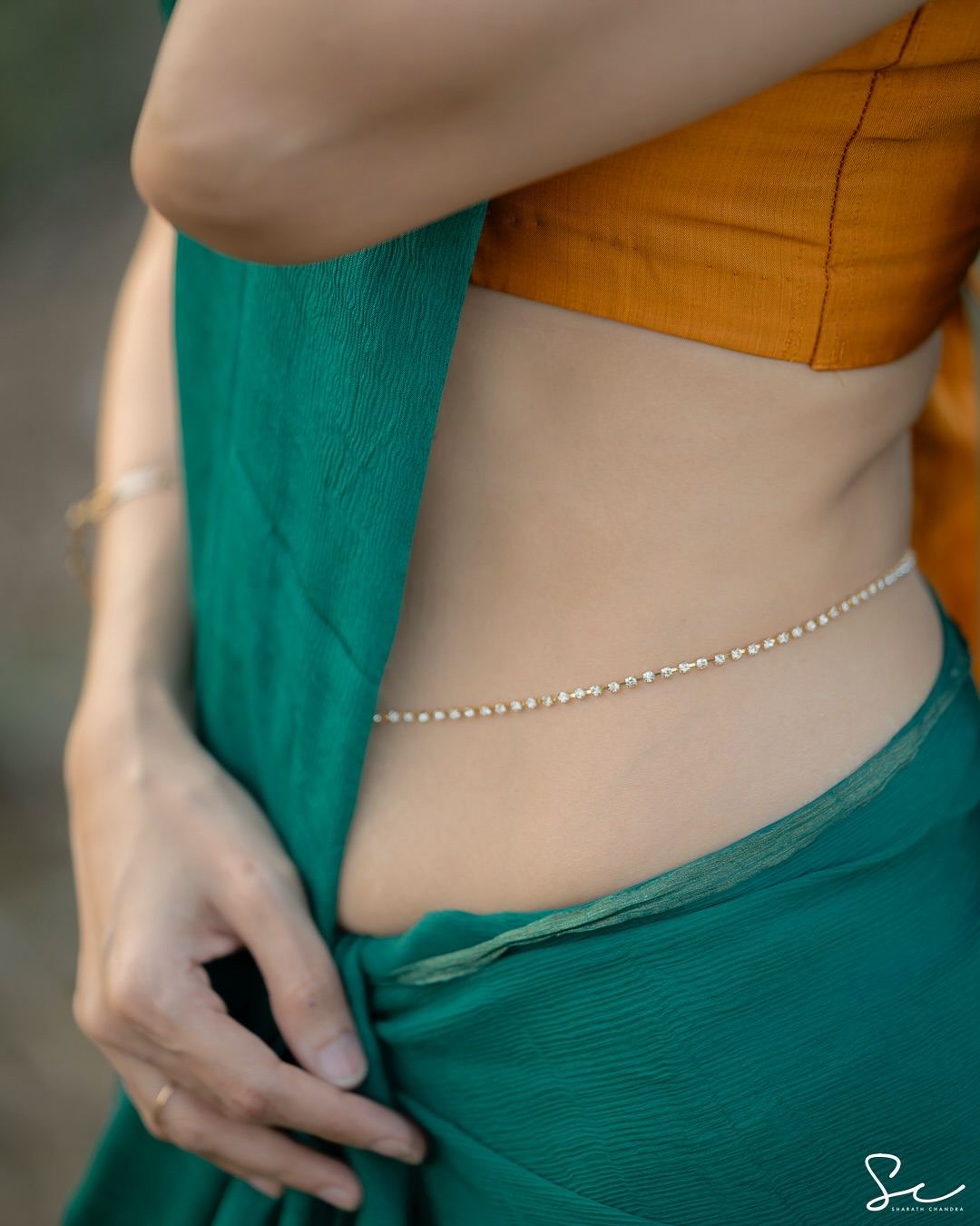 Radiant charm highlighted in Waist Chain on Point: Abhimanika collection.
