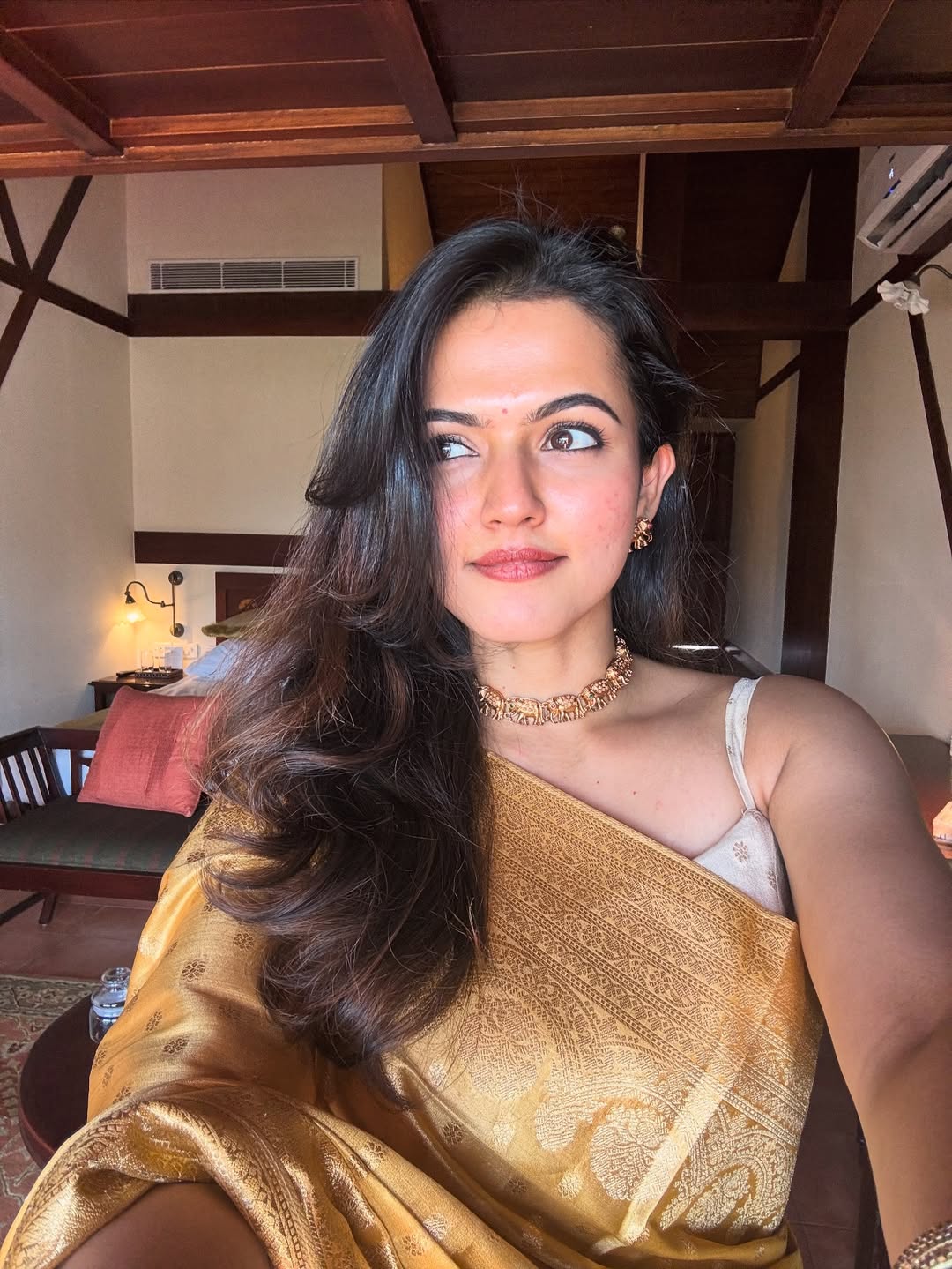 Aparna Das poses gracefully in sleeveless outfit with elegance