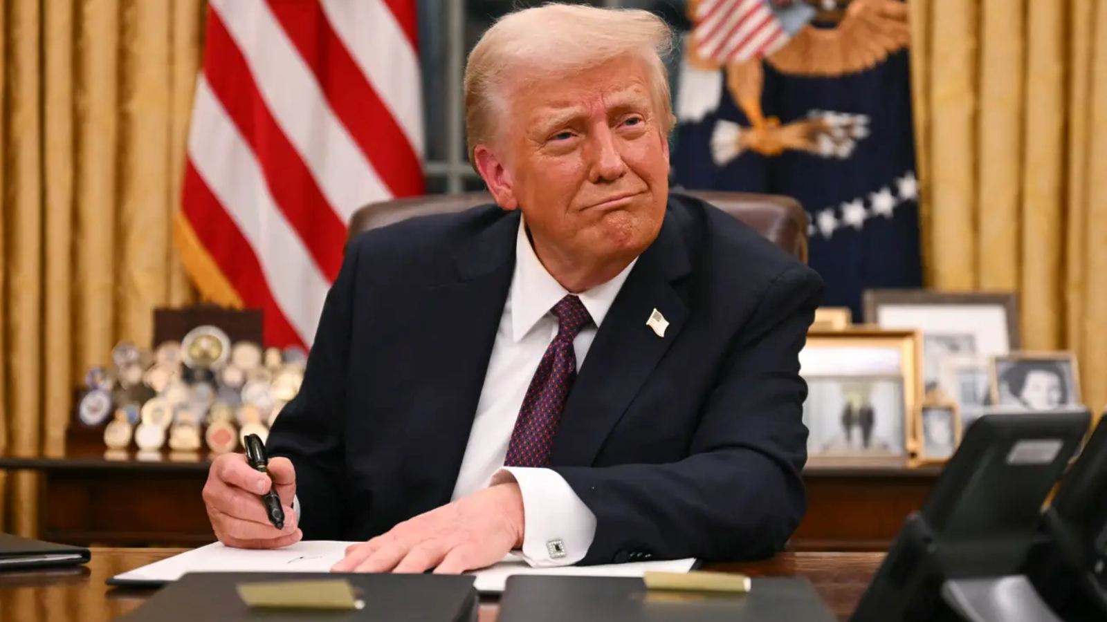 Donald Trump speaks on US-India relations with flags in background