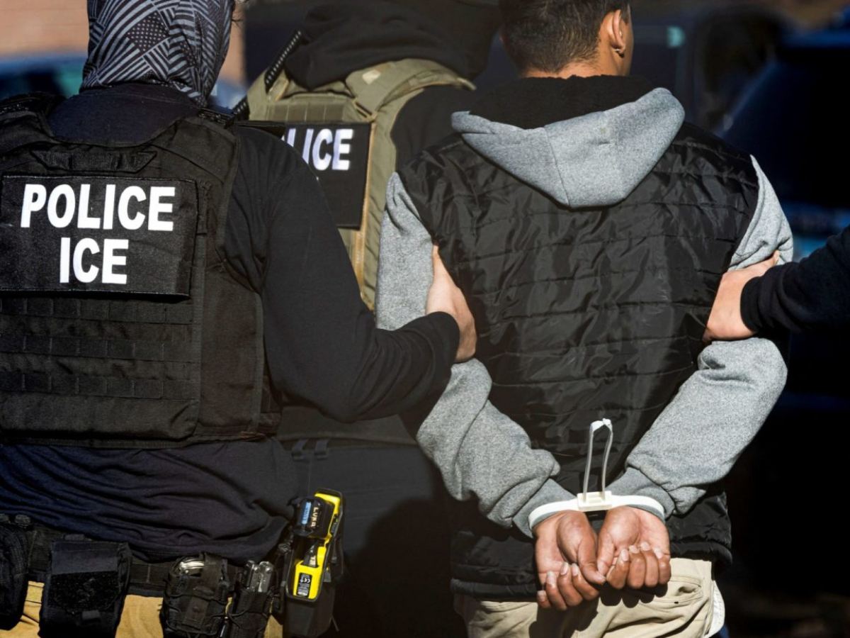 ICE officers arresting an OPT student