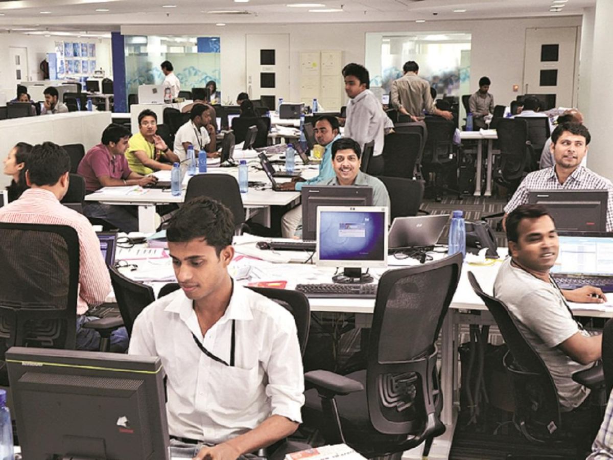 Indian IT employees in office with computers