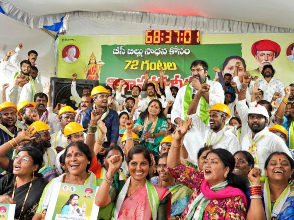 Kavitha during hunger strike for BC reservations with Ambedkar, Phule portraits