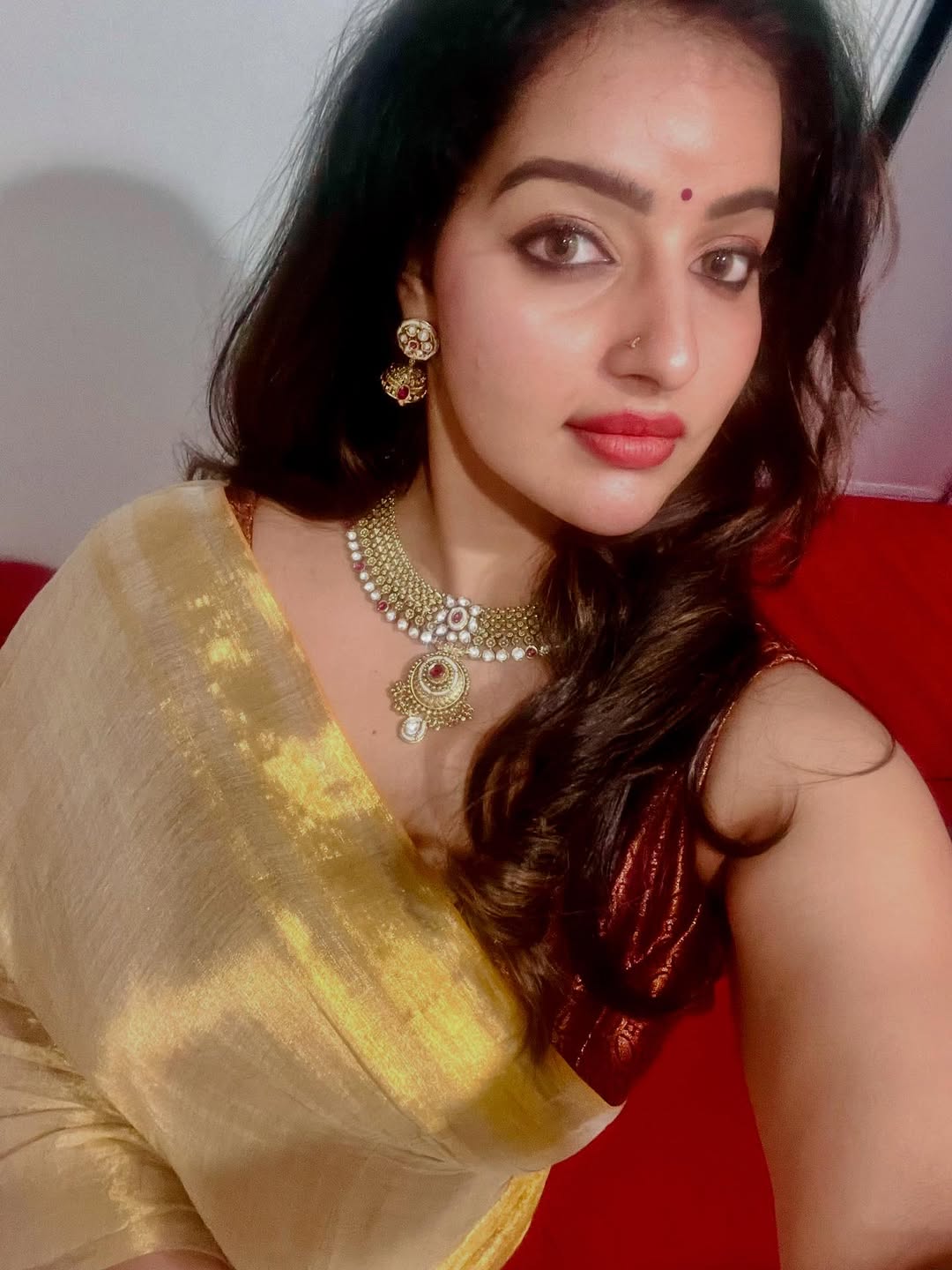 Radiant charm shines in Malavika Menon Serving a Hot Face Card photoshoot.