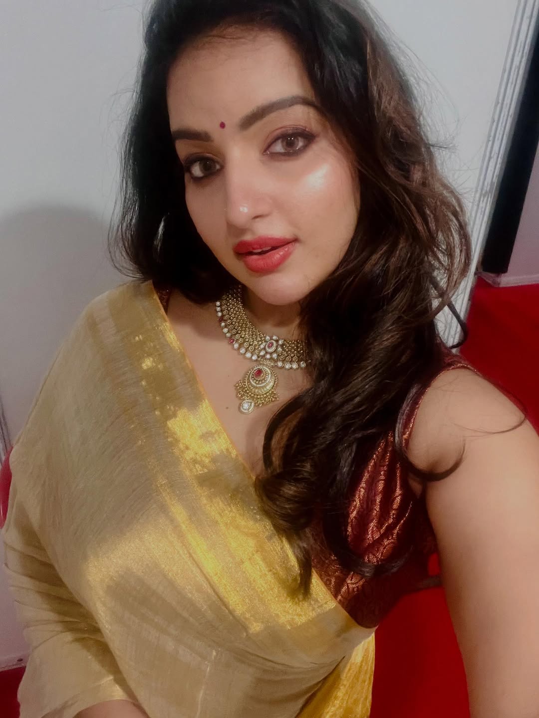 Graceful charm radiates in Malavika Menon Serving a Hot Face Card.