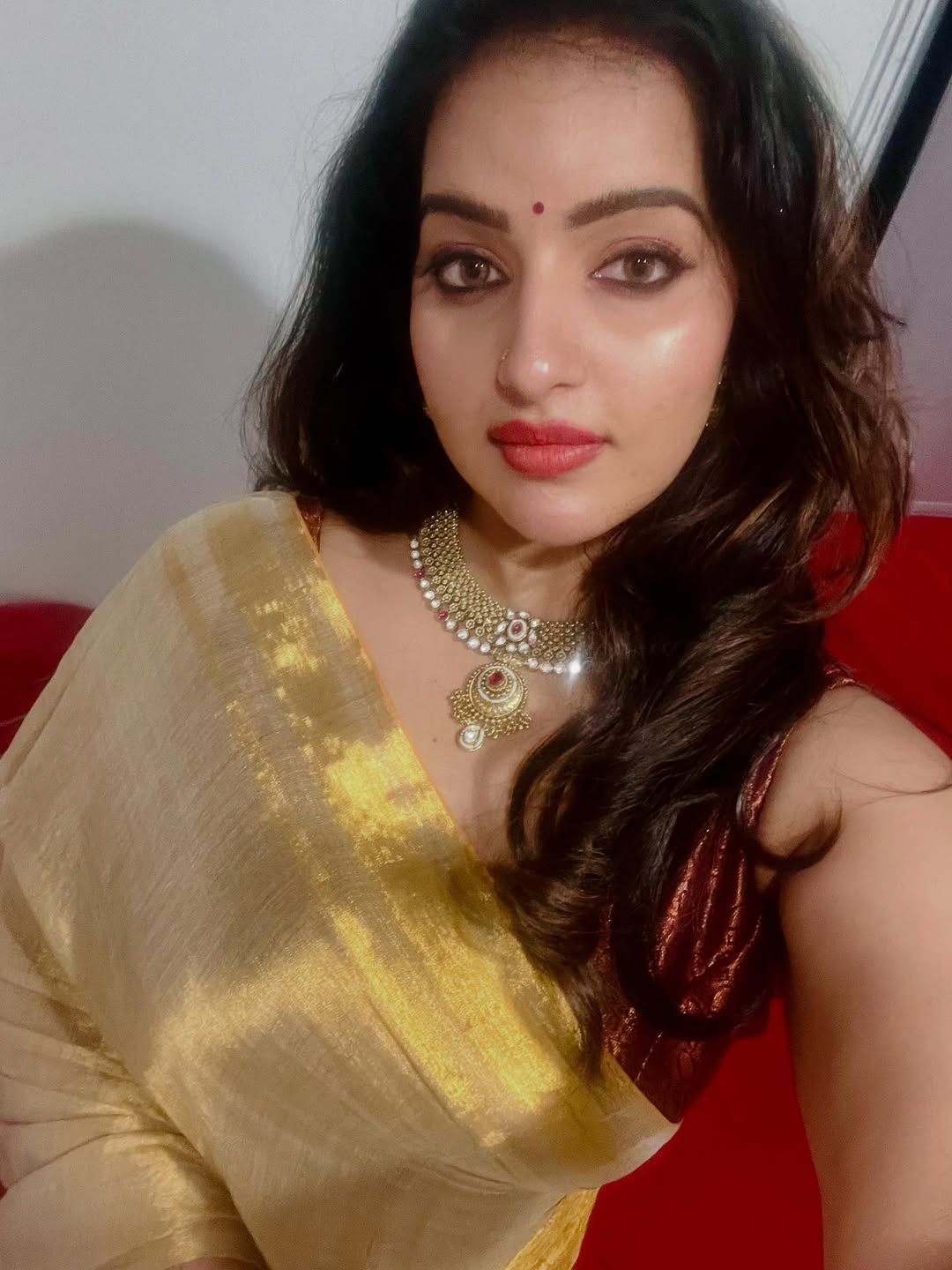 Chic pose captured in Malavika Menon Serving a Hot Face Card series.