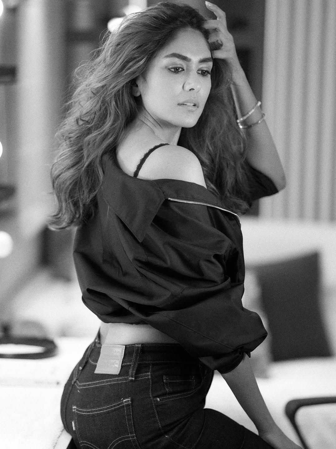 Elegant Mrunal Thakur showcases effortless beauty in monochrome fashion looks.