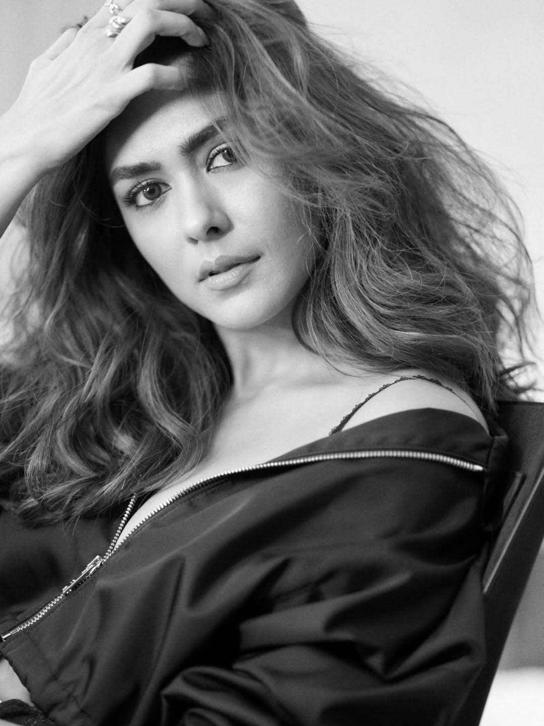 Mrunal Thakur captivates with her glamorous charm in sleek white ensemble.