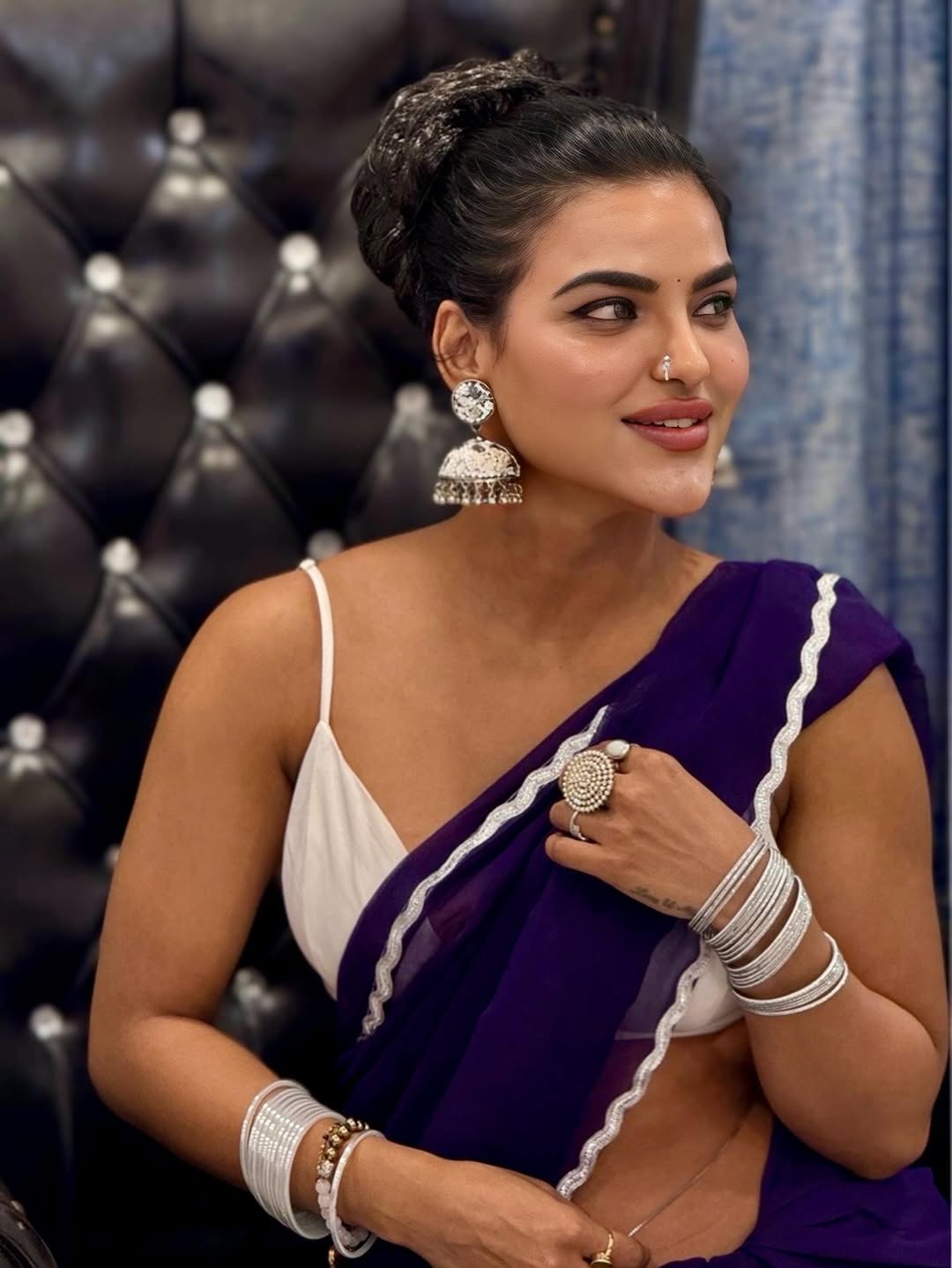 Stunning saree glam Uneka Ray Style striking a fashionable pose.