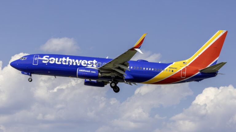 Southwest Airlines aircraft at airport with route map highlights