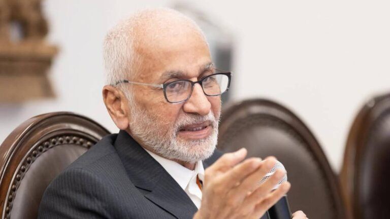 Vijayasai Reddy at political event with serious expression