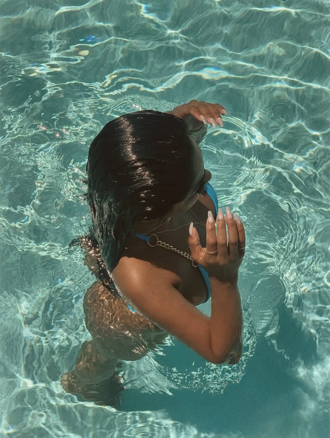Water heats up around Chandrika Ravi flaunting charm in blue swimwear.