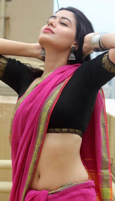 Her confident attitude shines through in this bold rooftop photoshoot.