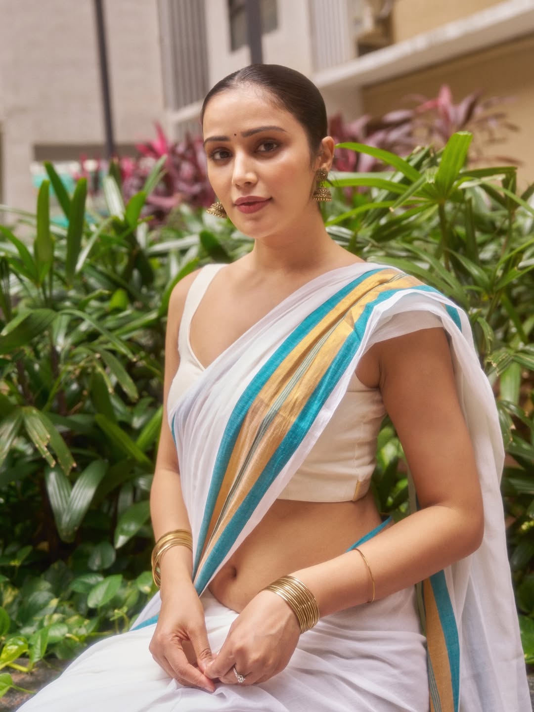 Anaira Gupta glowing in white look with red hot vibes.