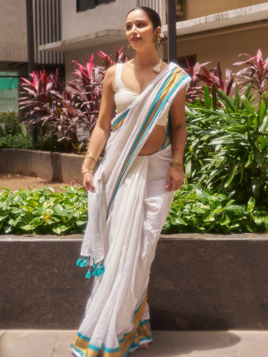 Elegant Anaira Gupta impresses with chic white outfit style.