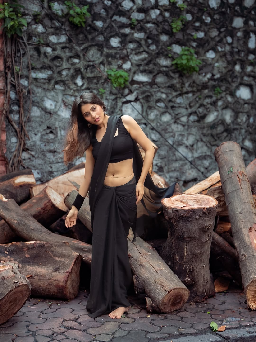 Aparna's bold look is completed with jhumkas and black bangles.