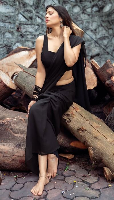 Aparna looks alluring and confident in her modern saree avatar.