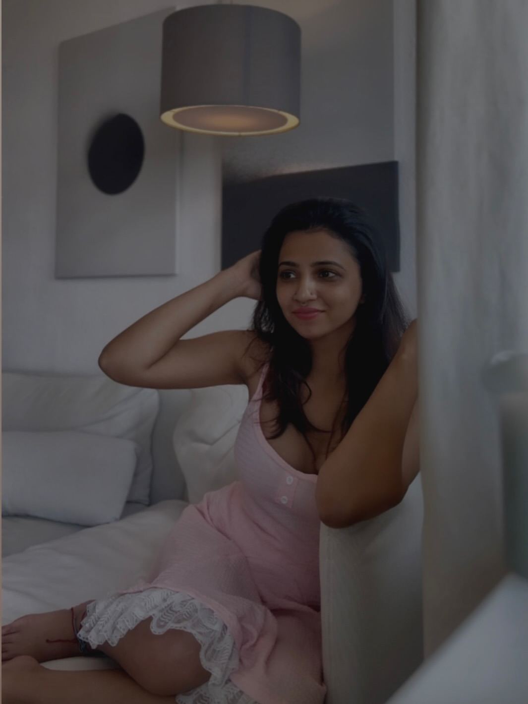 The soft lighting beautifully highlights Darsana's features in this shot.