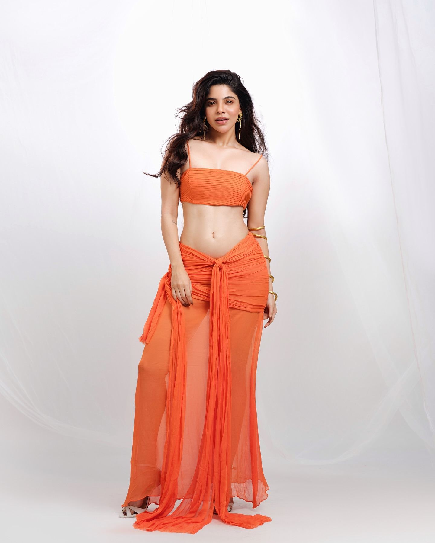 Divyabharathi Flaunts Toned Waist In Orange Glam