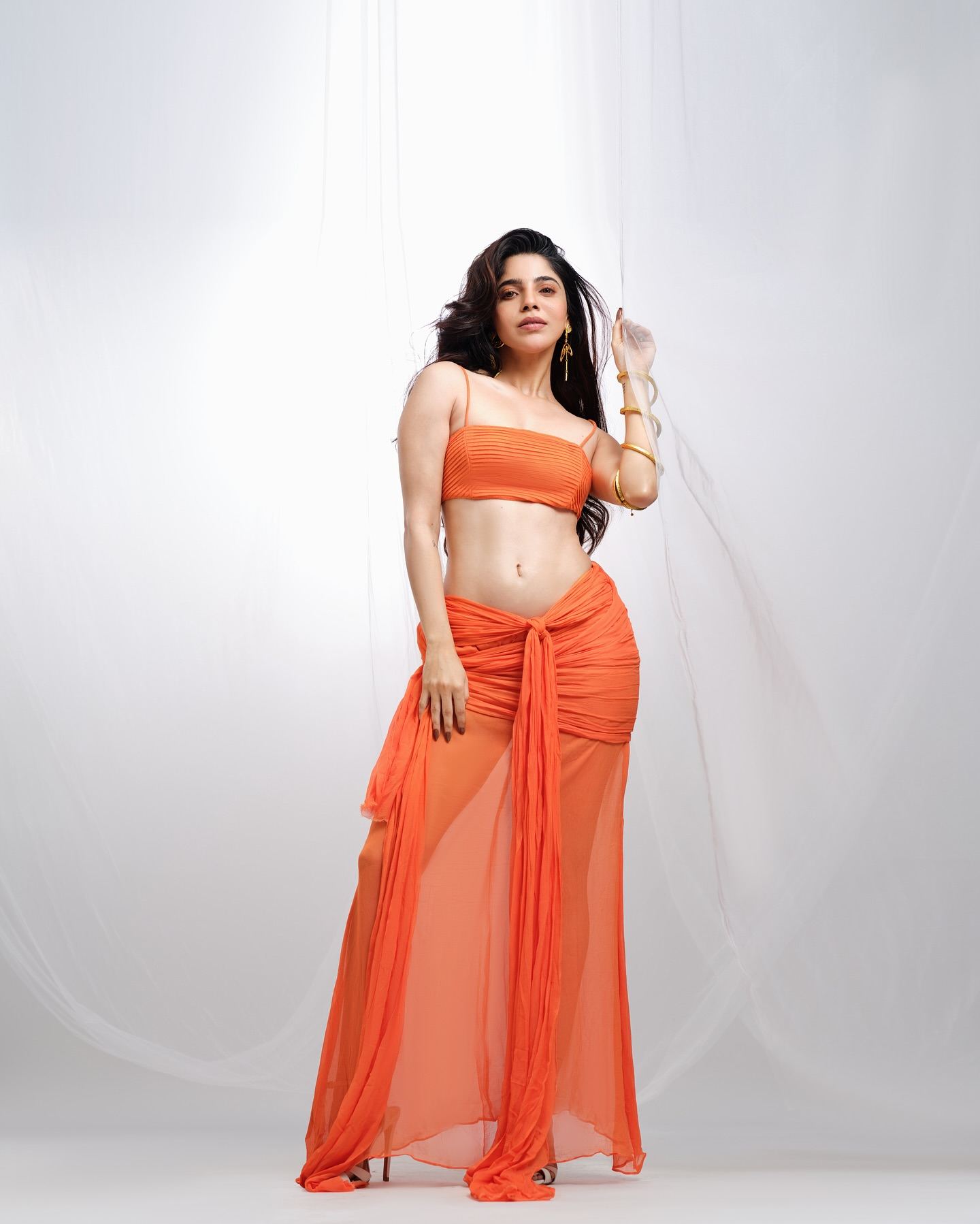 Divyabharathi Flaunts Curves In Hot Orange Look