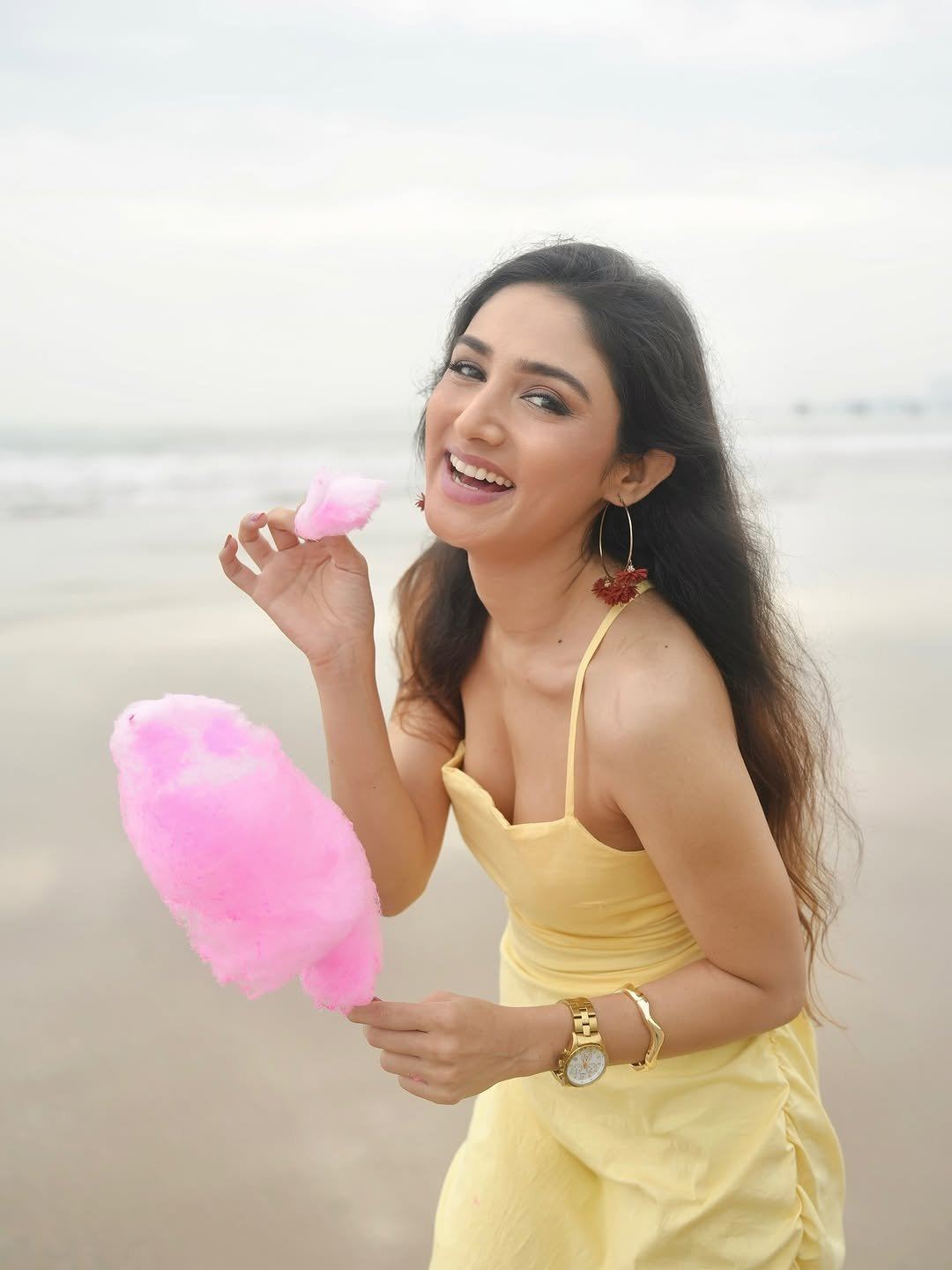 Donal Bisht flaunts style in yellow dress holding cotton candy