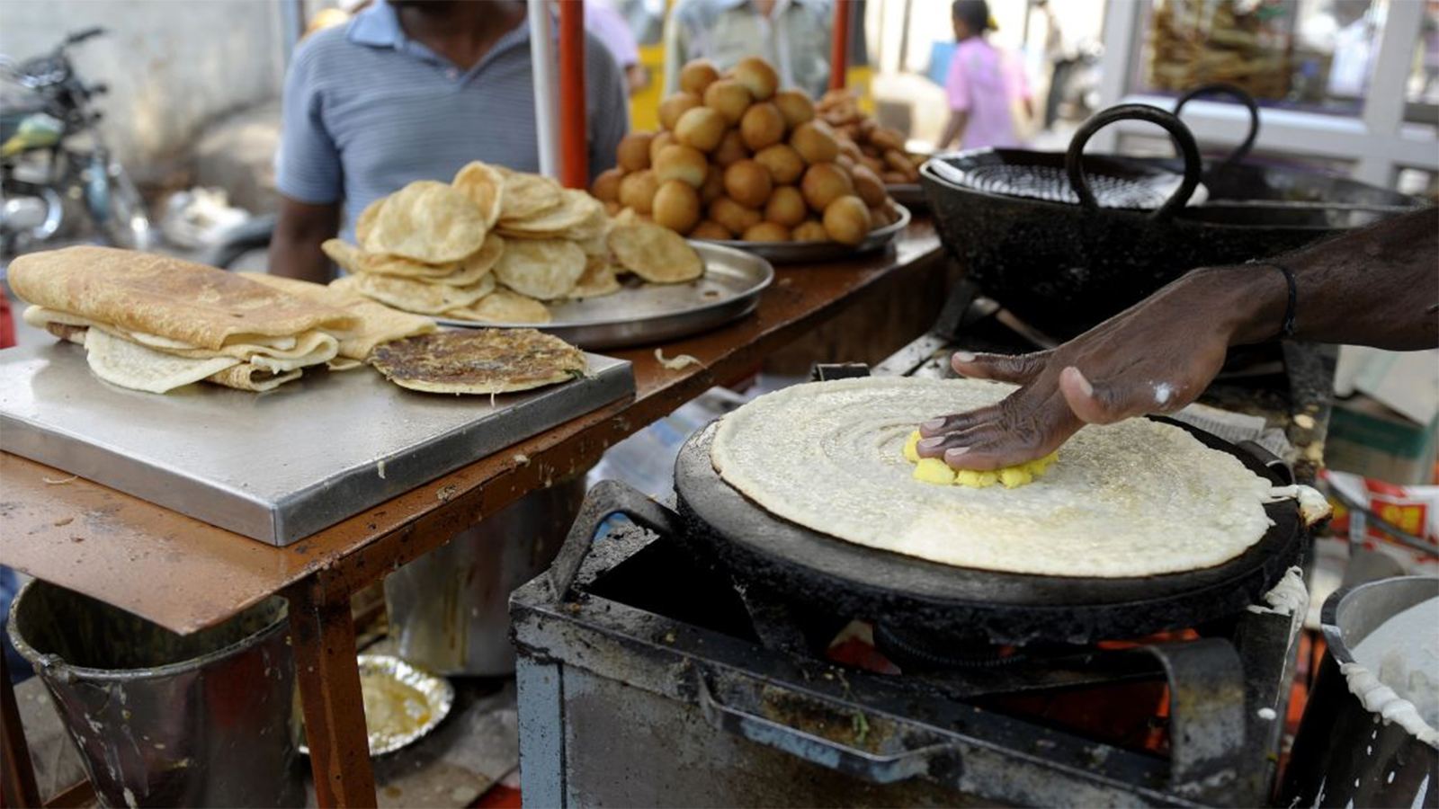 Dosa being chopped for fusion recipe