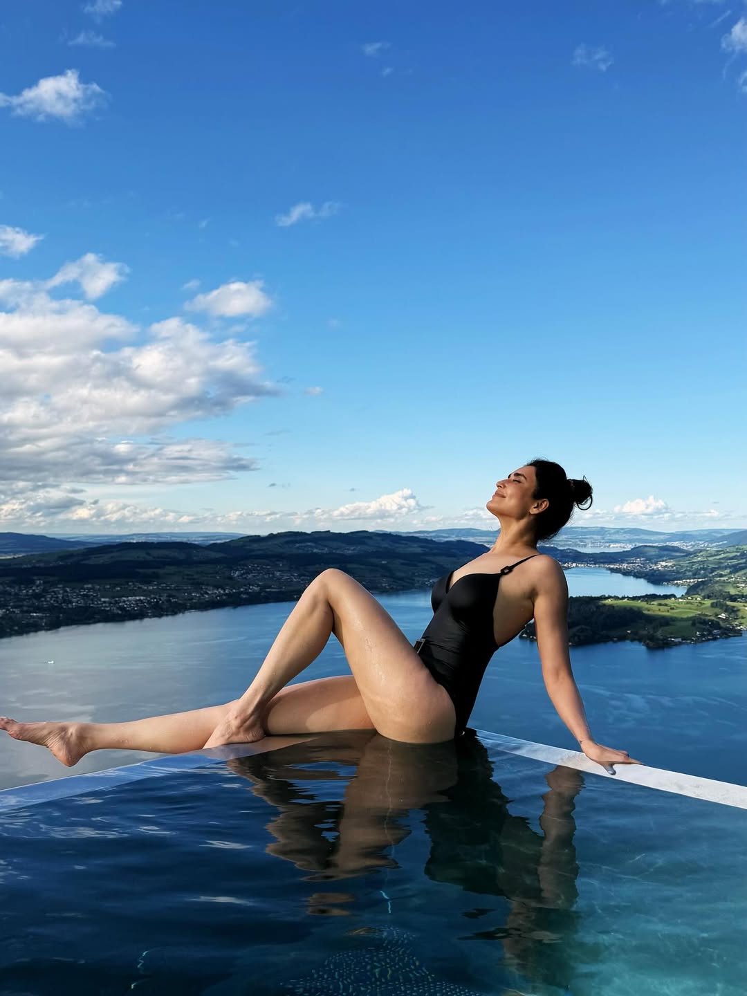 Karishma Tanna soaking up the sun in a stylish black swimsuit.