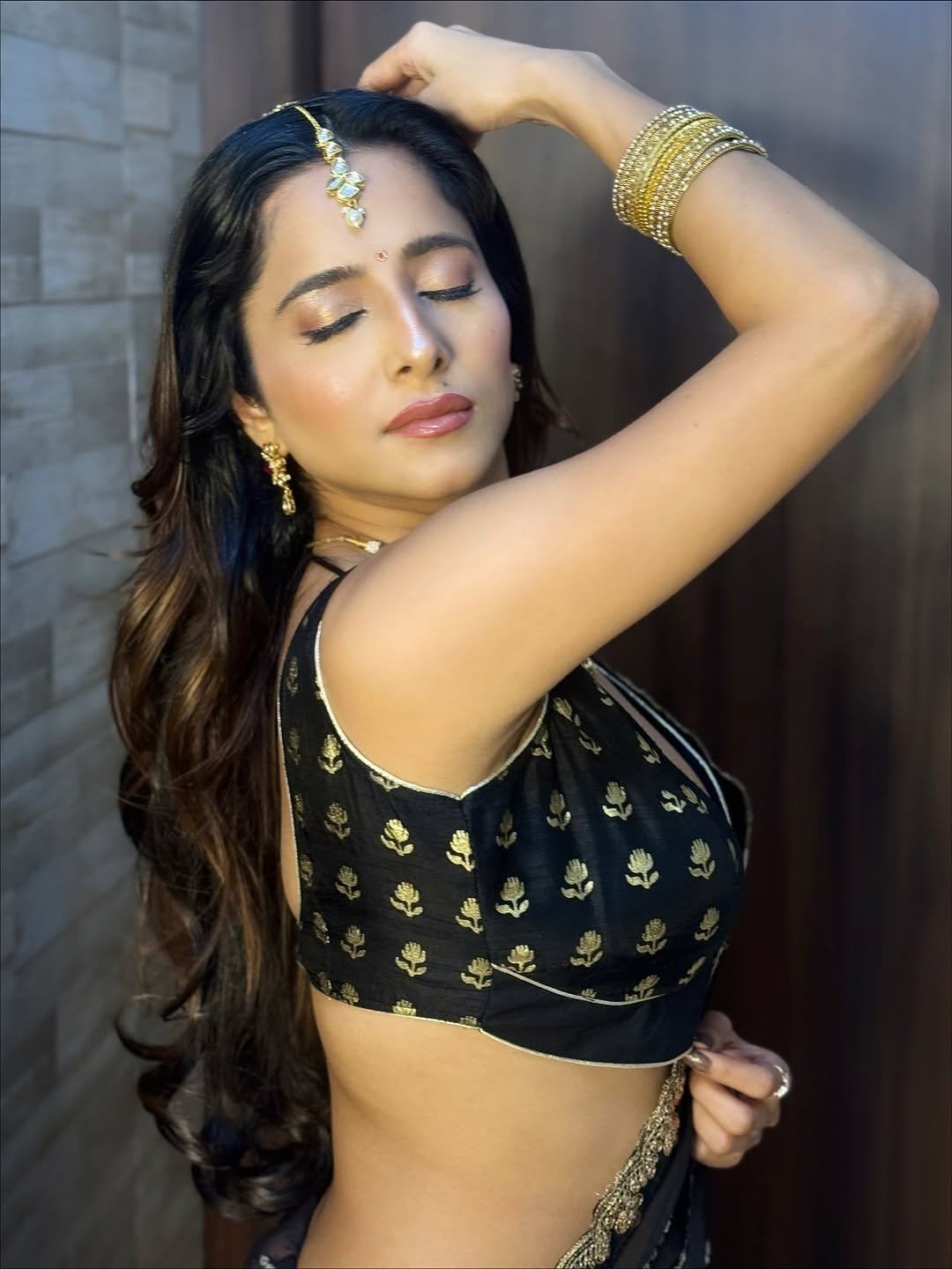 Kate Sharma's Sensuous Pose In A Black Saree