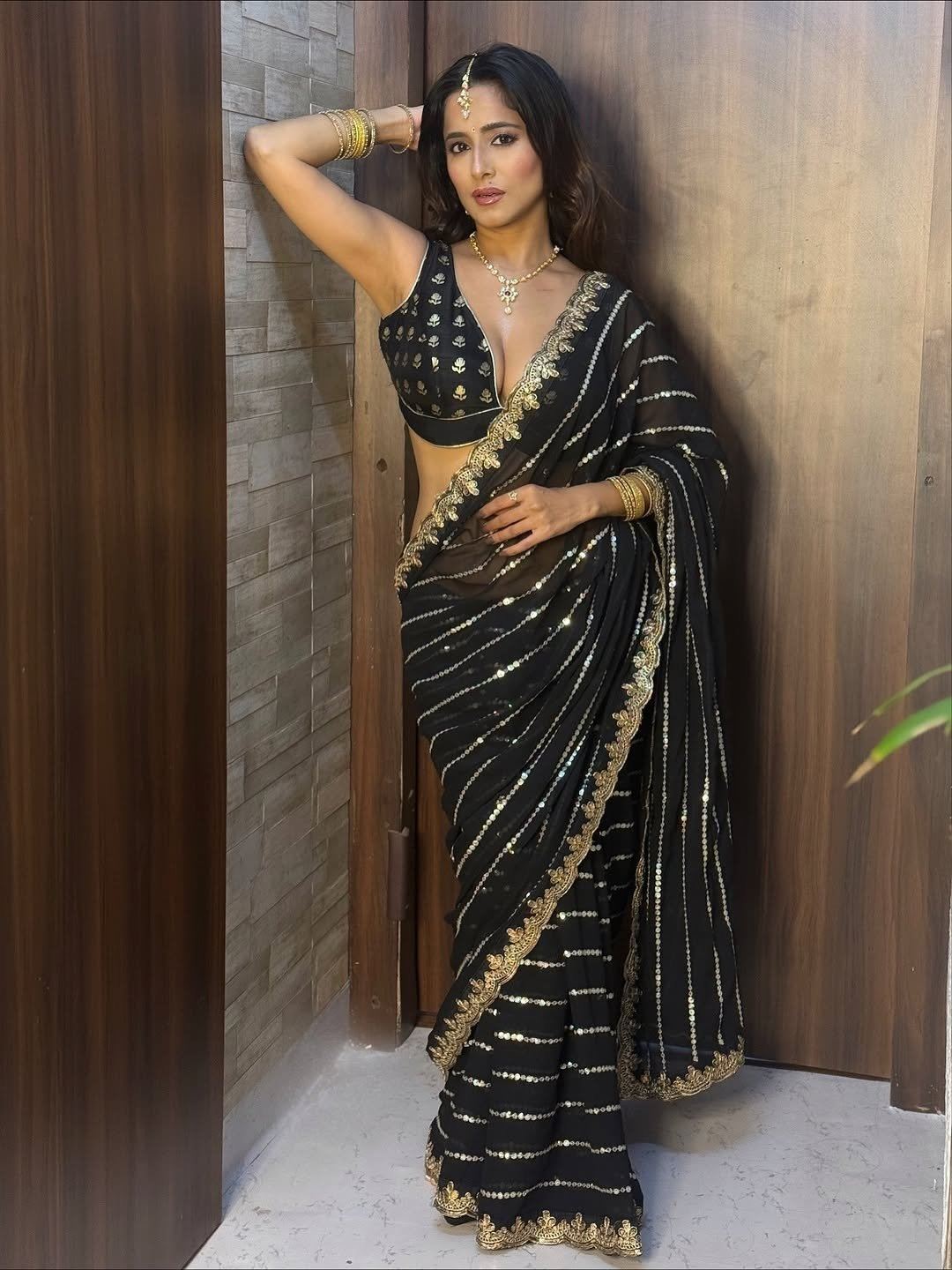 Kate Sharma's Graceful Smile In A Black Saree