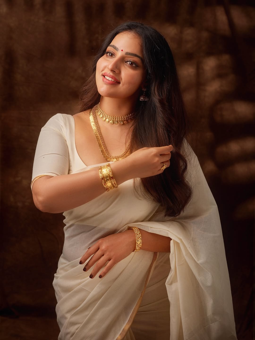 Elegant Onam attire styled beautifully by Malavika Menon.